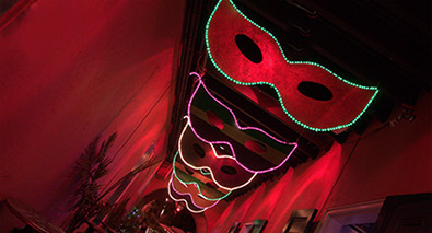 Tap into your creativity at Nikon School Photo of masks with a red hallway background