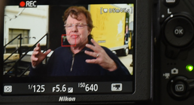 Learn how to create videos at Nikon School Lindsay Silverman photo of Joe McNally on the rear LCD of a camera during a shoot