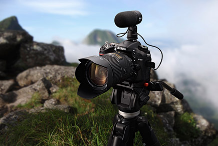 Travel like a pro Photo of a Nikon D7100 and ME-E mic on a tripod, on a mountaintop