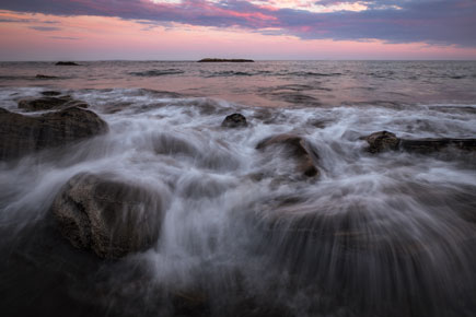 Take control of light with this Nikon School class Adam Woodworth photo of crashing surf on rocks, taken in low light