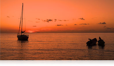 Shoot in low-light with the COOLPIX AW120 low-light photo of boats at sunset on the water highlighting the AW120's CMOS sensor
