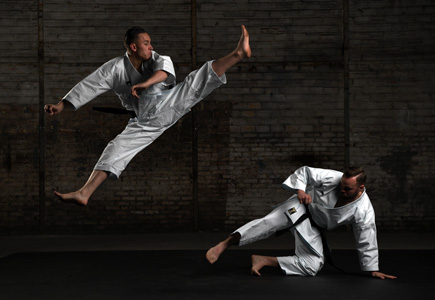 D850 DSLR photo of two karate fighters in low light