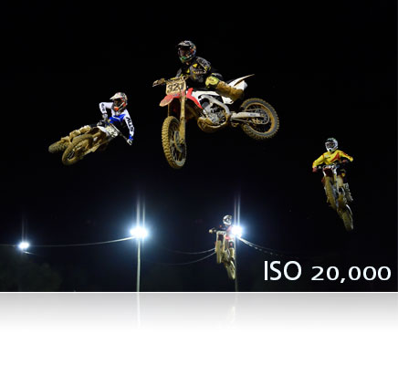 Nikon D4S photo of a gymnast with a hoop in air, shot at ISO 3200 showing noise free high ISO range