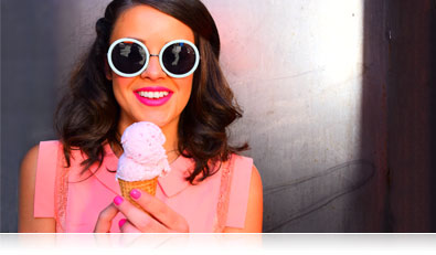 D5500 photo of a woman in big sunglasses eating ice cream
