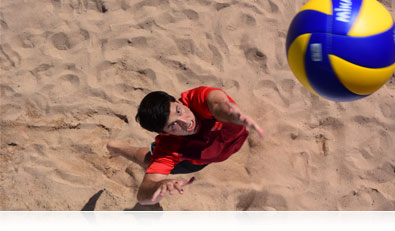 Nikon 1 V3 photo of a beach volleyball player spiking the ball