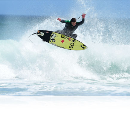 Photo of a surfer in air over a wave, shot with the AF-S NIKKOR 500mm f/4E FL ED VR lens