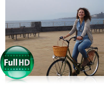 S7000 photo of a woman on a bicycle on a pier with water in the background