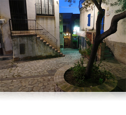 COOLPIX S7000 photo of a low light scene of a courtyard