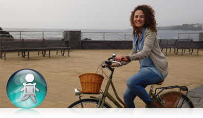 COOLPIX S7000 photo of a woman on a bicycle with the icon for Subject Tracking inset