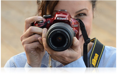Photo of woman holding Nikon D3200 HD-SLR