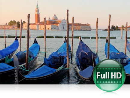 Explore Full HD video possibilities with the COOLPIX P7700 photo of blue tarp covered gondolas docked in Venice, Italy with a small island in the far background