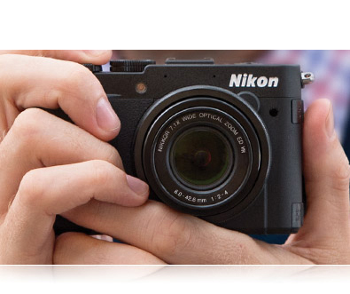 The COOLPIX P7700 is designed to be used photo of a pair of hands holding a COOLPIX P7700
