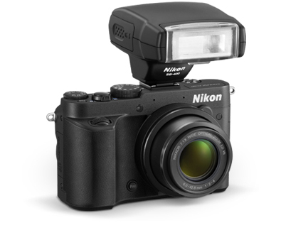 The COOLPIX P7700's accessory shoe accepts Speedlights and more photo of the COOLPIX P7700 with the SB-400 Speedlight on the accessory shoe