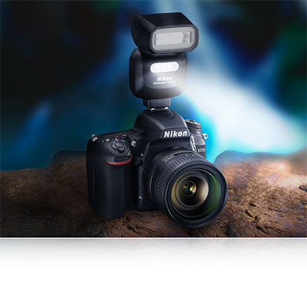Brighten Your HD Video with the SB-500 Nikon SB-500 Speedlight on the hotshoe of a Nikon D750 with lens, showing the illumination from the LED light source