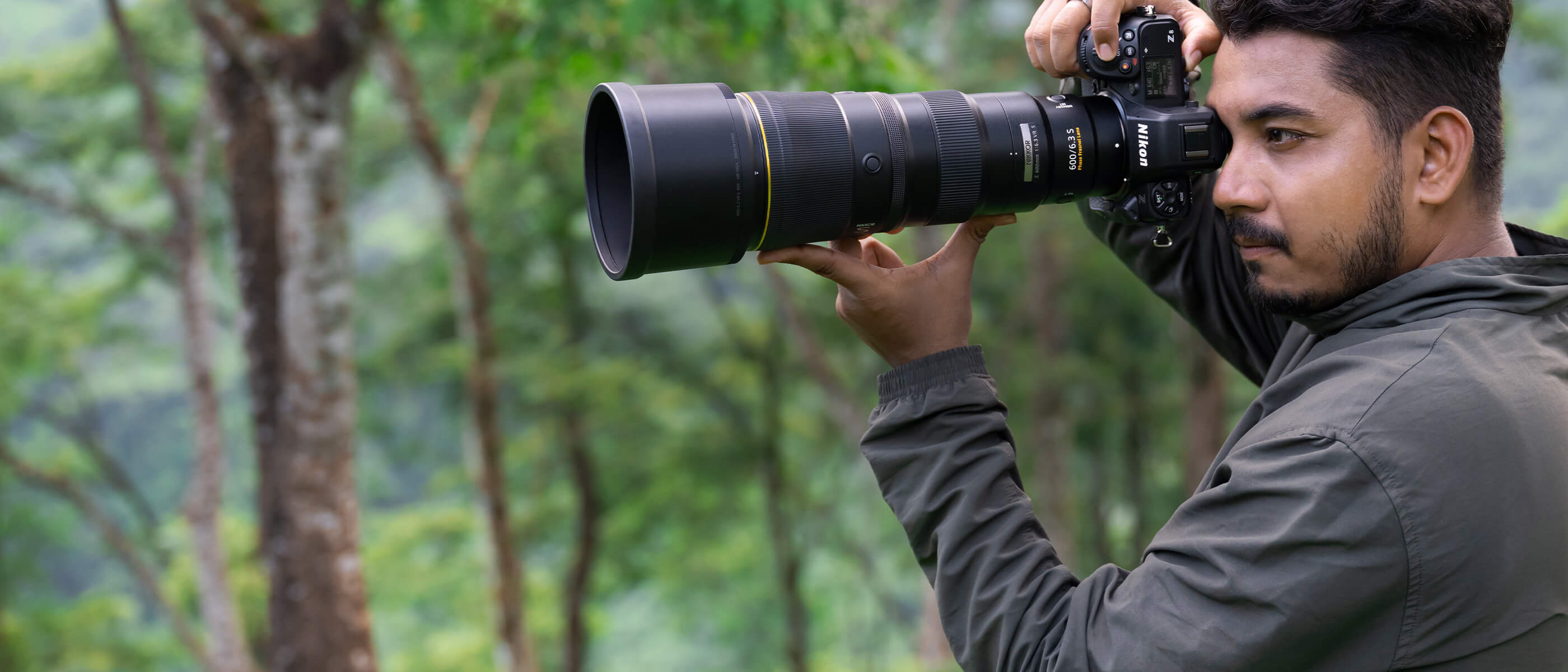Photo of a man with a NIKKOR Z 600mm f/6.3 VR S lens on a Nikon mirrorless camera body