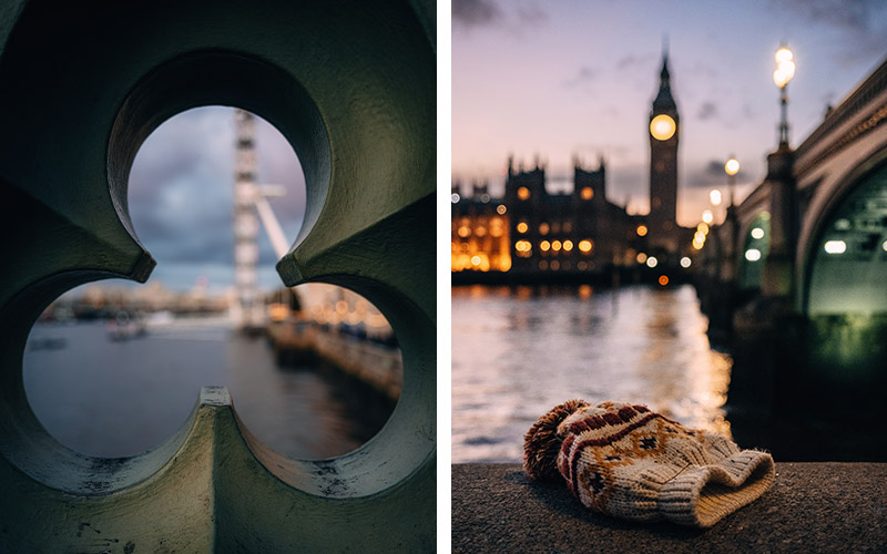 photo looking through a cut out and photo of a hat on a ledge with the city at night in the background, taken with the NIKKOR Z 26mm f/2.8