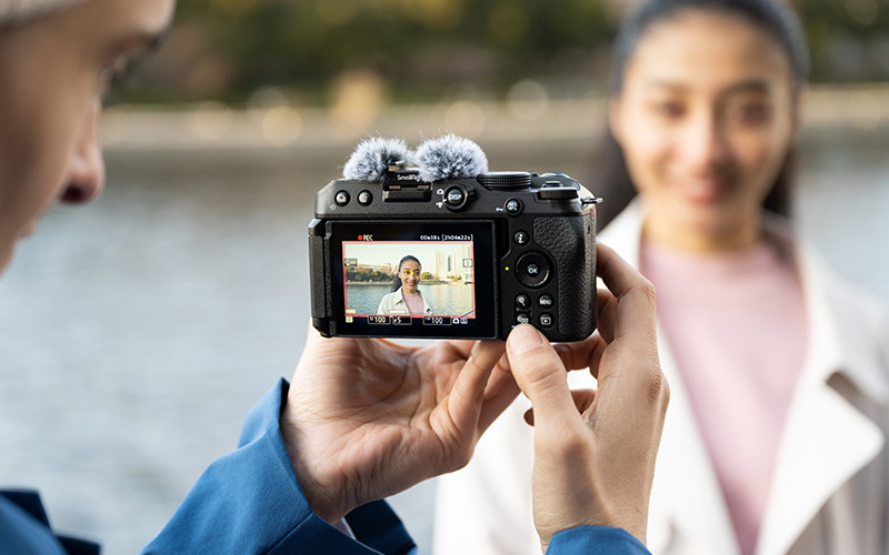 photo of a guy photographing a girl using the Z 30 and NIKKOR Z DX 12-28mm f/3.5-5.6 PZ VR lens