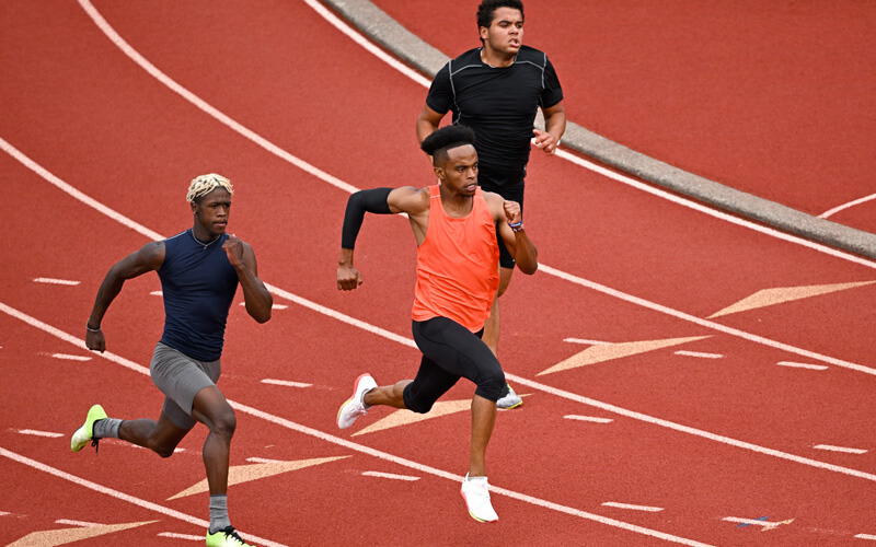 Photo of runners on a track, taken with the NIKKOR Z 100-400mm f/4.5-5.6 VR S lens