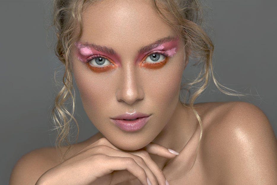 Photo of a model with bright pink eyeshadow staring at the camera, taken with the Z 7 and NIKKOR Z 50mm f/1.8 S lens