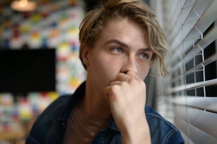 photo of a model looking out of a window taken with the Z 7 and NIKKOR Z 50mm f/1.8 S lens