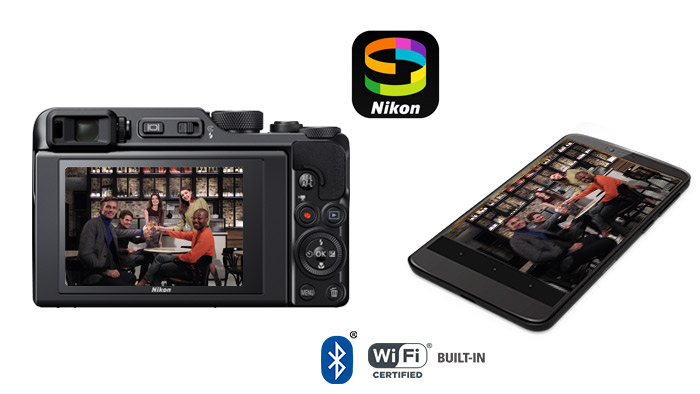 Photo of the back of the Nikon COOLPIX A1000 and a smartphone with a photo of a group of people on the LCD of both devices