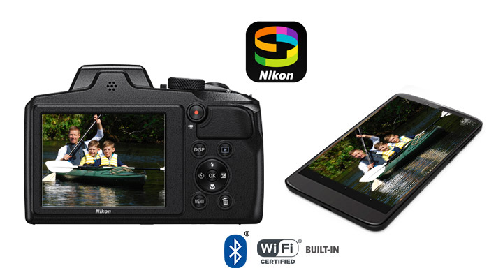 Photo of the Nikon COOLPIX B600 and a smartphone with a photo of a kayaking dad and two sons on the LCDs of both devices