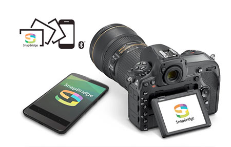 SnapBridge logo and D850 DSLR and smartphone with the SnapBridge logos