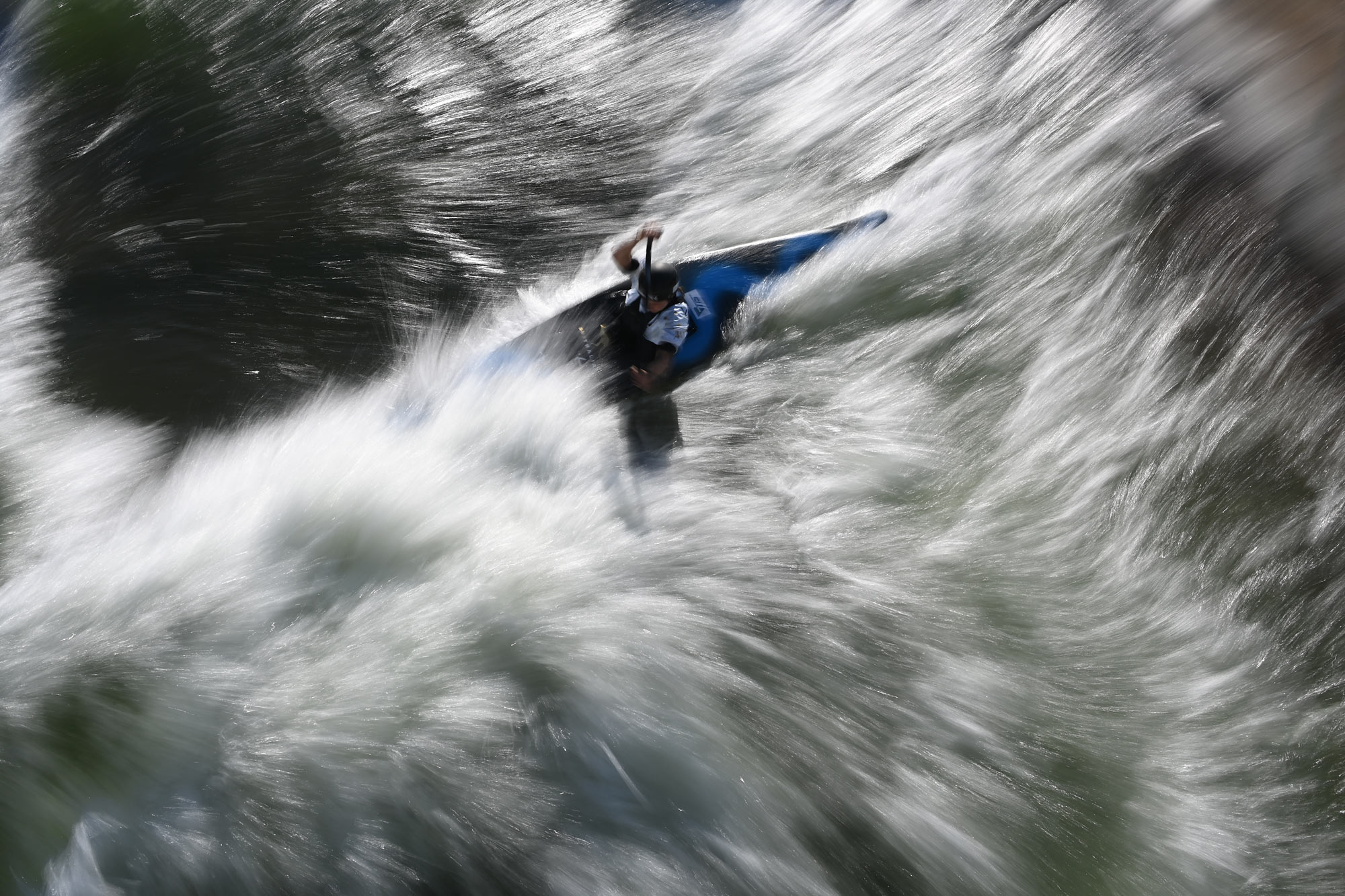 D6 DSLR photo of a kayaker in white water, taken from above