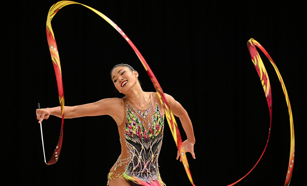 D6 DSLR photo of a rhythmic gymnast