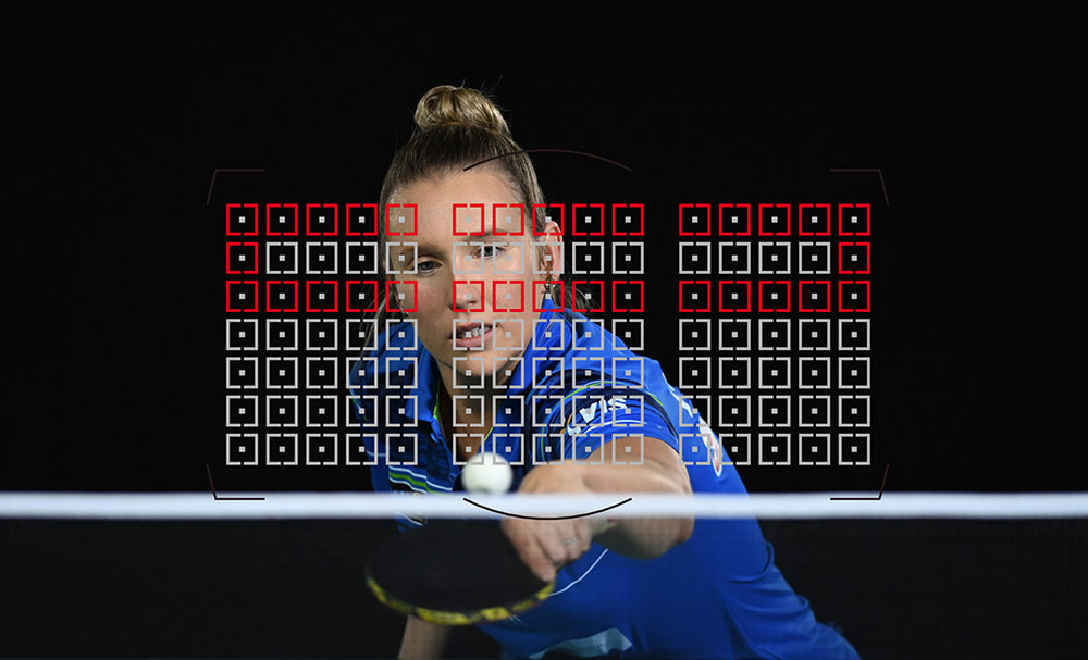 Photo of a table tennis player with the AF grid overlayed, taken with the D6 DSLR