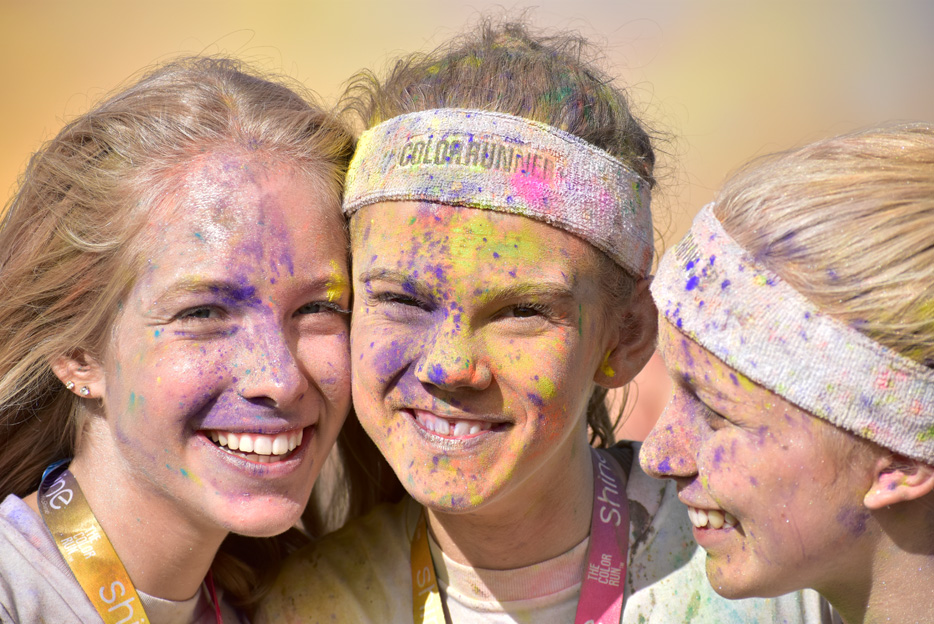 Photo of three women after a color run, taken with the AF-P DX NIKKOR 70-300mm f/4.5-6.3G ED VR lens