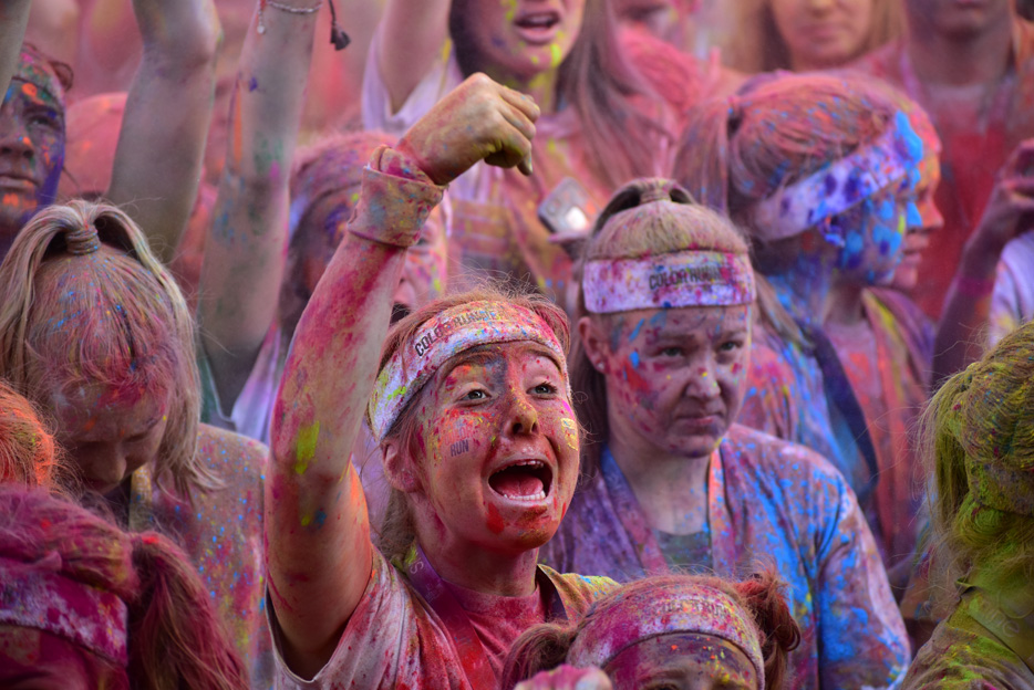 Photo of women covered in colored dust from a color run, taken with the AF-P DX NIKKOR 70-300mm f/4.5-6.3G ED VR lens