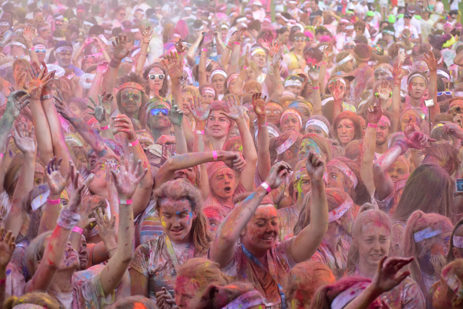 Wide shot of a large group of women covered in paint dust from a color run, taken with the AF-P DX NIKKOR 70-300mm f/4.5-6.3G ED VR lens