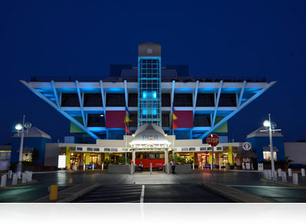 Photo of a modern looking building lit up at night, taken with the AF-S DX NIKKOR 18-300mm f/3.5-5.6G ED VR lens.