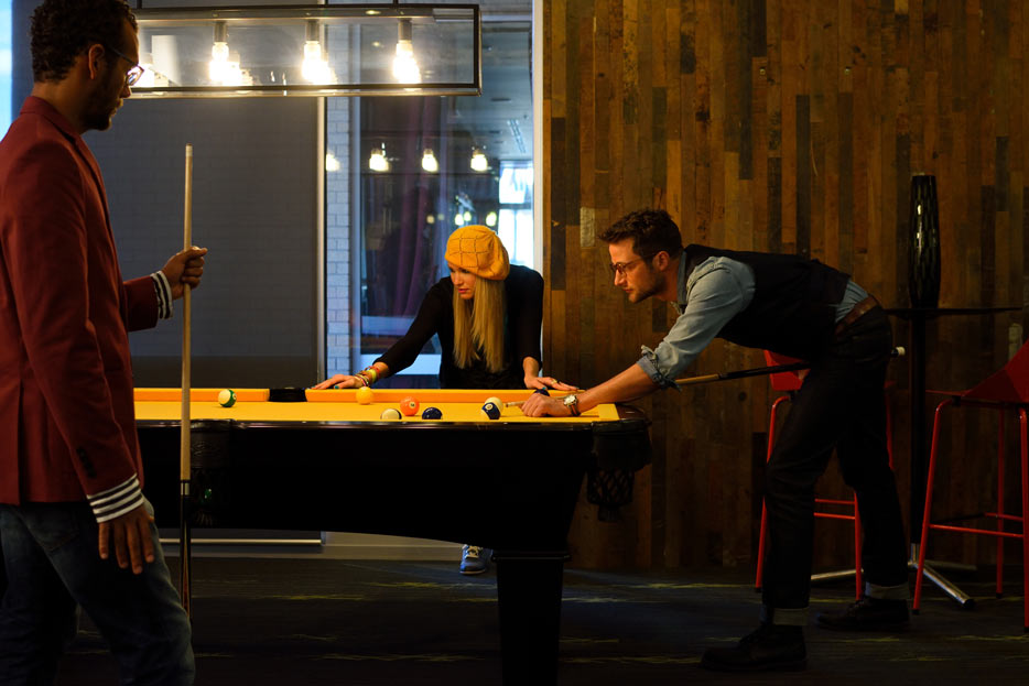 AF-S DX NIKKOR 35mm F1.8G photo of three people playing billiards