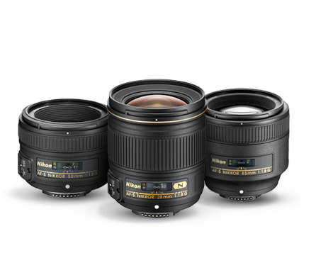 Nikon's collection of FX f/1.8 prime lenses, including the 28mm, 50mm and 85mm NIKKORs.