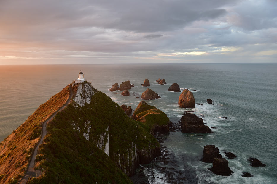 Photo of a lighthouse on a cliff surrounded by water, shot with the AF-S NIKKOR 24-70mm f/2.8E ED VR lens