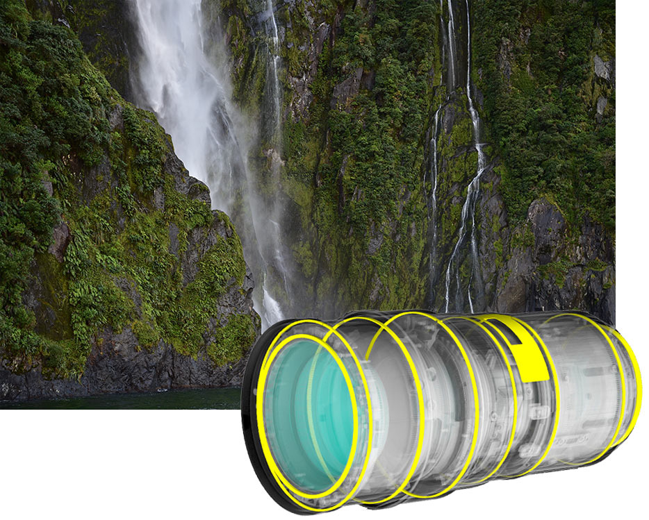 AF-S NIKKOR 24-70mm f/2.8E ED VR photo of a waterfall coming off a cliff, inset with an illustration of the lens design